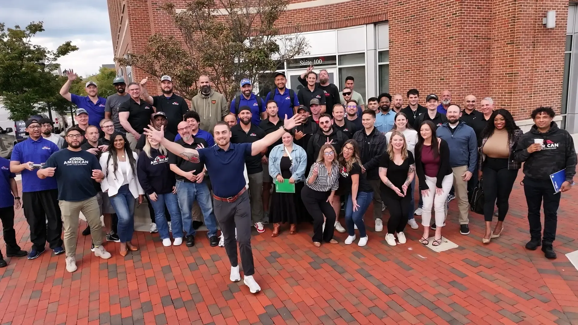 The American Home Contractors team celebrating together outside our office