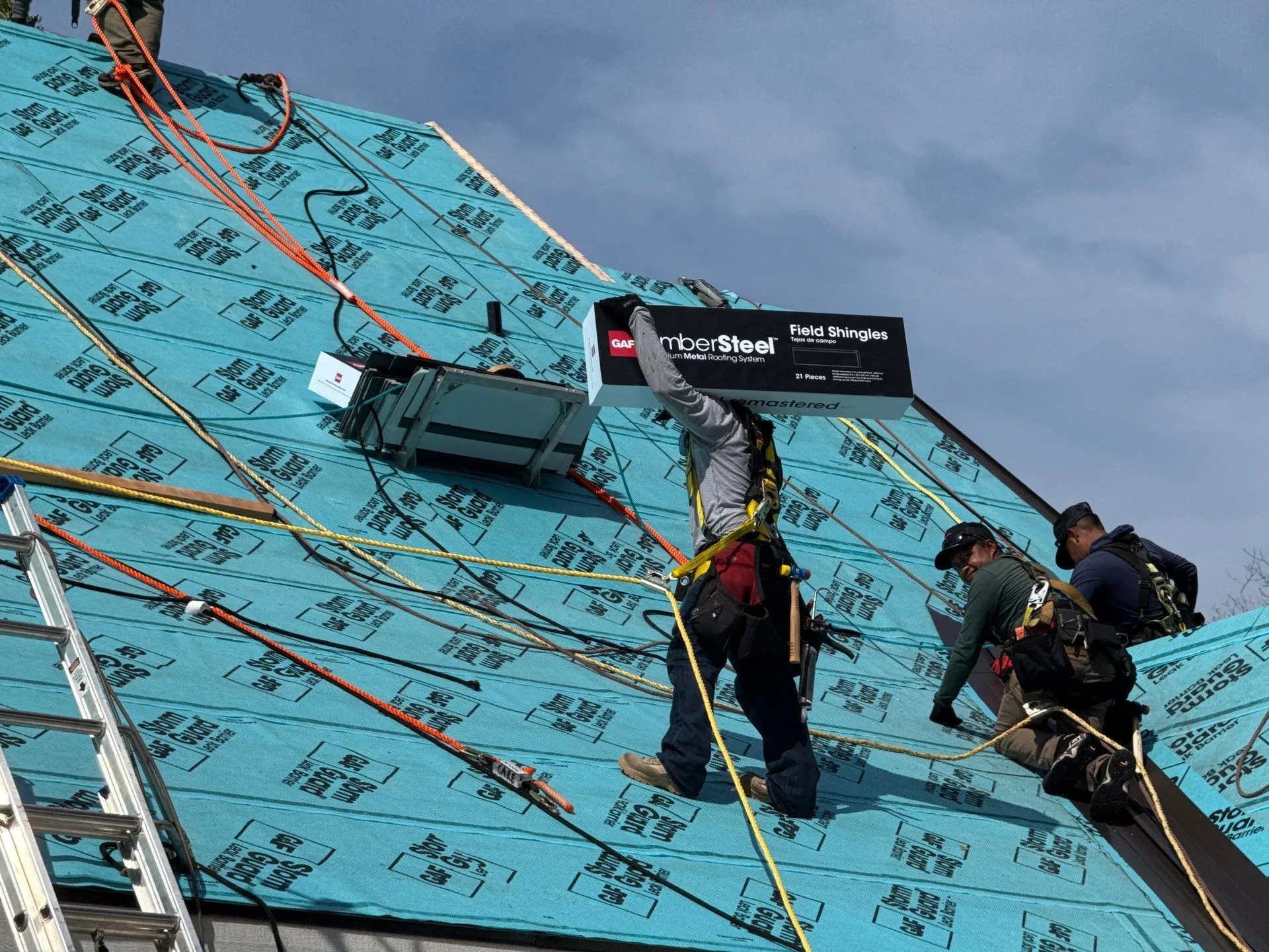 crew GAF timbersteel metal roof install by American Home Contractors near Edgewood