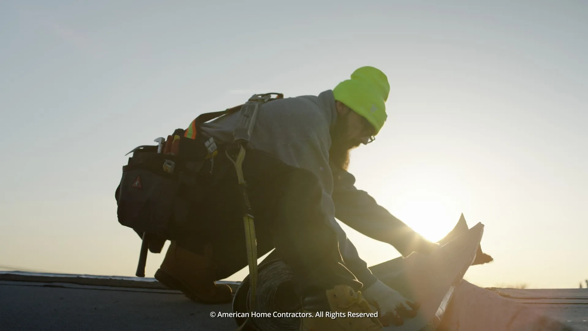 flat roof sunset silhouette by American Home Contractors near Baltimore