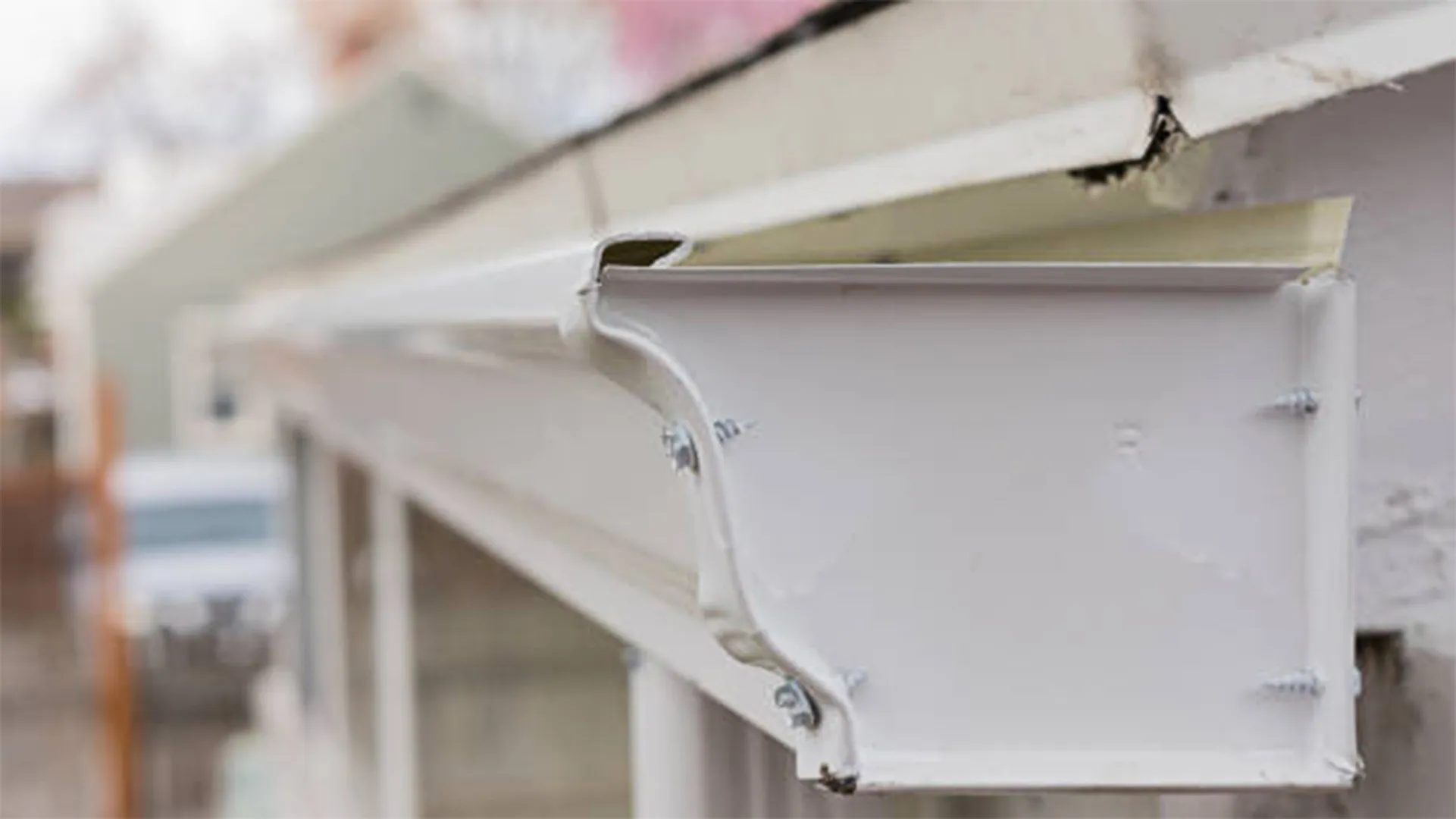 gutter damaged end cap closeup by American Home Contractors near Frederick