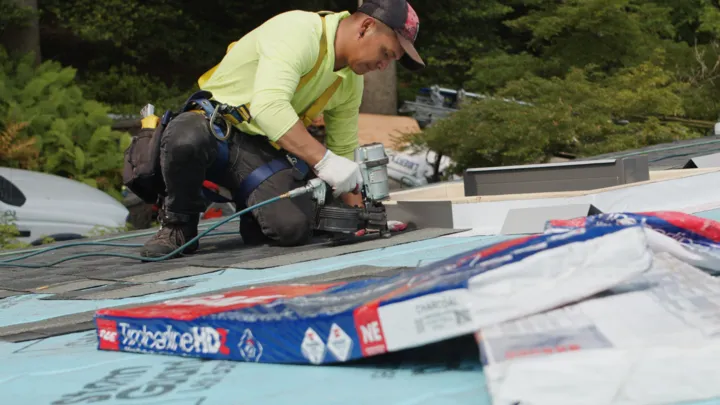 roofer nailing timberline hdz bundle by American Home Contractors near Burke